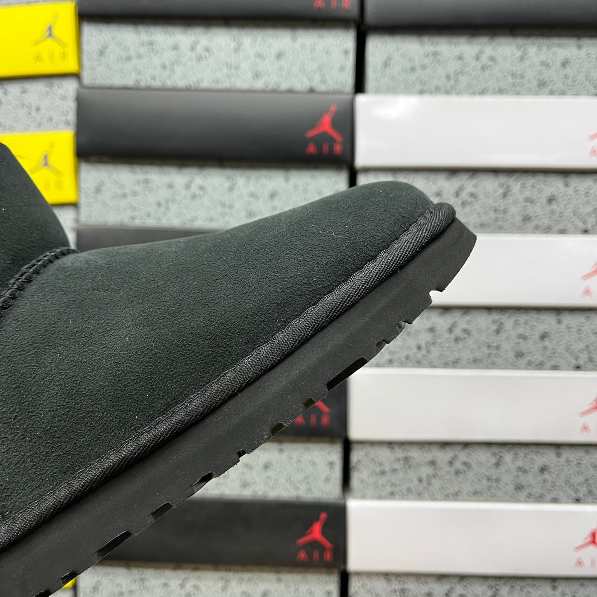 UGG Button-Detail Mini Boots in Black with Plush Lining